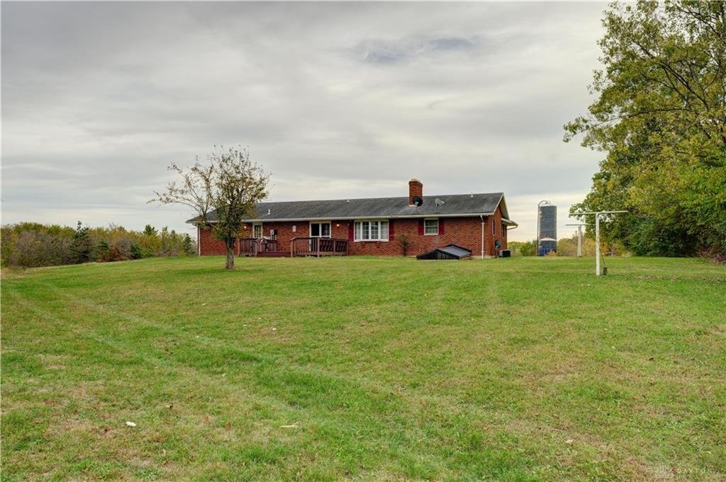 Rear exterior view showing acreage and barn