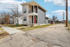 Open-concept kitchen, dining and living area inside 1260 W 1st Street