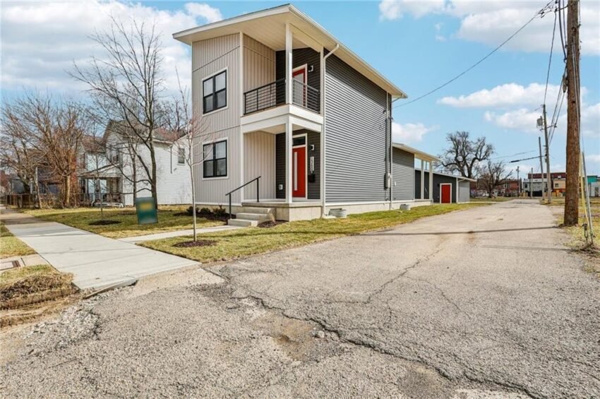 Open-concept kitchen, dining and living area inside 1260 W 1st Street