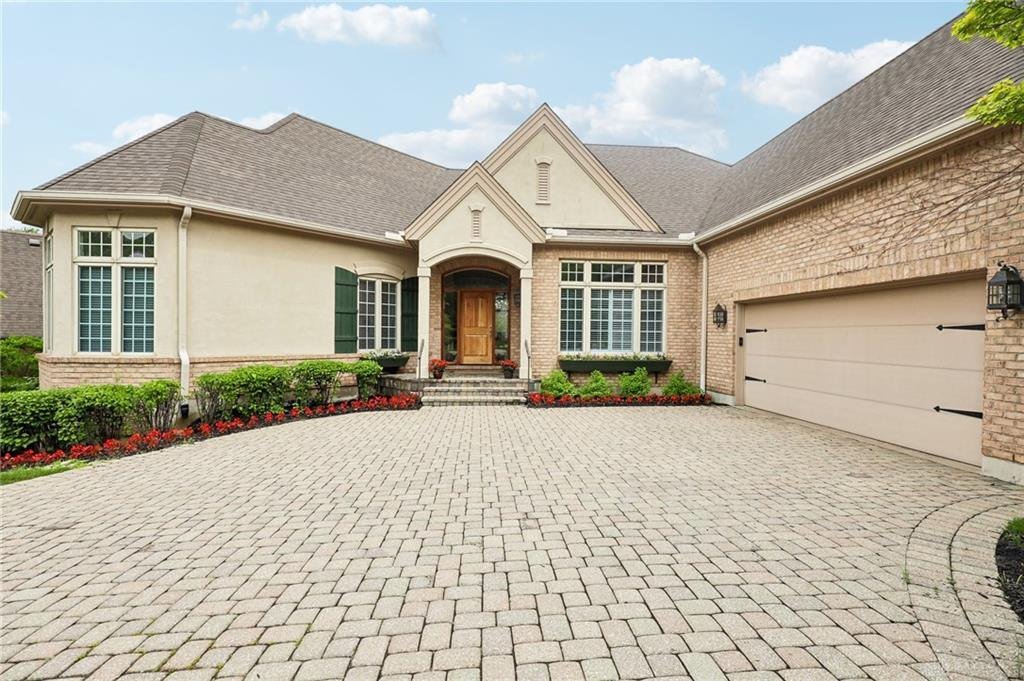 Front exterior of 269 Rue Marseille in Kettering with a pavered driveway and covered porch