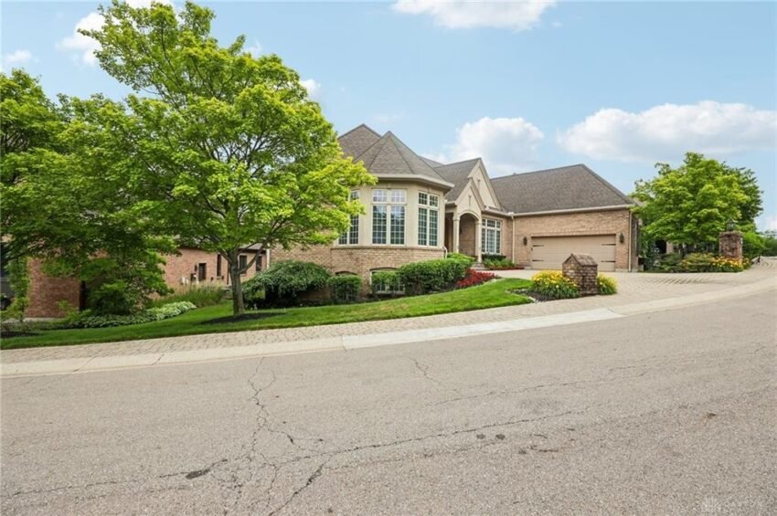 Great room with 11-foot ceilings, custom built-ins and a gas fireplace