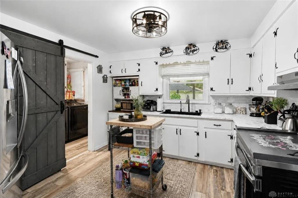 Primary bedroom converted from a family room with a custom sliding barn door