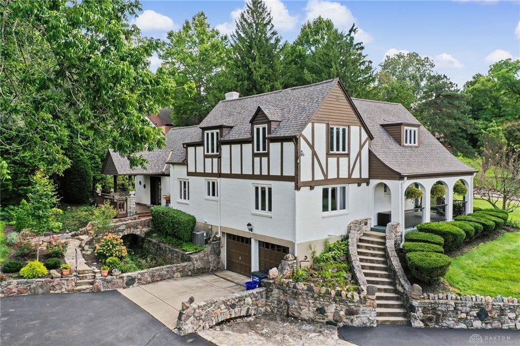 Tudor Revival home at 3504 Deweese Parkway with white accents, dark half-timbering and steep gables